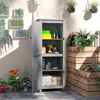 An outdoor storage cabinet with its doors open, showing various items inside, placed on a patio next to a wooden planter box. Náhľad obrázku produktu