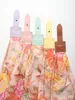 Five straps with leather accents and floral fabric hanging down. Produktbild-Vorschau