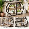 A collage of images showing a 3-tier console table with an arched metal frame, styled with plants and decorative items. The bottom images highlight the arched base design and the 3-tier storage shelf. Podgląd zdjęcia produktu