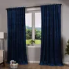 A room with a window covered by dark blue velvet curtains. Produktbild-Vorschau