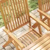 Close-up view of wooden garden chairs on a paved patio with grass in the background. Podgląd zdjęcia produktu