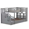 A gray wooden bunk bed with stairs and storage drawers, shown against a white background. Voir les images du produit