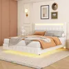 A bedroom scene with a white bed, dressed with bedding and throws, and illuminated by LED lights. Náhľad obrázku produktu