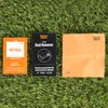 A set of screen protector cleaning supplies laid out on artificial grass. Produktbild-Vorschau