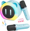 A light blue karaoke machine shaped like a pig, with two microphones and musical notes. Produktbild-Vorschau