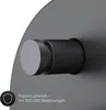 A close-up view of a black under-counter faucet with a silver knob, set against a dark gray background. Text and a shield icon are visible in the lower-left corner. Produktbild-Vorschau