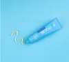 A tube of toothpaste and a swirl of toothpaste on a light blue background. Náhled obrázku produktu