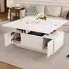 A white lift-top coffee table with storage is shown in a living room setting, with a sofa and side table in the background. Produktbild-Vorschau