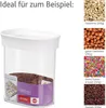 A transparent food storage container with a white lid, partially filled with brown flakes. The image also shows examples of food items that can be stored in the container, such as sunflower seeds, hazelnuts, sprinkles, and raisins, with their names and qua Anteprima dell’immagine prodotto