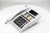 A white corded telephone with large buttons and photo speed dial slots is placed on a white surface. Náhľad obrázku produktu