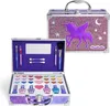 An open makeup case with various makeup products and applicators inside, and a closed makeup case in the background. Produktbild-Vorschau