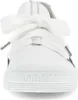 A close-up, front-facing view of a white sneaker with a large white bow tied at the laces. Produktbild-Vorschau