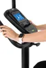 Close-up of a person's hands interacting with the console of a stationary exercise bike. Produktbild-Vorschau