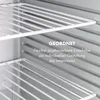 Interior view of a mini refrigerator with adjustable shelves. Produktbild-Vorschau