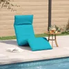 A turquoise chaise lounge chair is set up on a patio next to a swimming pool, with a small table holding a pitcher of lemonade nearby. Anteprima dell’immagine prodotto