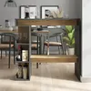 A modern dining area with a bar table and chairs. Voir les images du produit