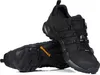 A pair of black Adidas Terrex hiking shoes are shown against a white background. Anteprima dell’immagine prodotto