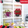 Hanging flower pots with colorful flowers displayed on a white window frame. Náhľad obrázku produktu
