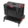 A black Qbrick System ONE Transport Platform 2.0 with red accents, shown with a black storage box on top. Náhľad obrázku produktu