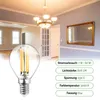 A product image showcasing an LED light bulb in the foreground, with a room interior featuring a chandelier, doors, and a mirror in the background. Technical specifications are listed on the right. Produktbild-Vorschau