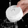 A hand holding a white mini-USB food chopper under running water. Náhľad obrázku produktu