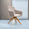 A single chair in a studio setting with a textured wall behind it. Produktbild-Vorschau
