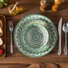 A table setting with plates, cutlery, and bread. Produktbild-Vorschau