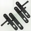 Four black door handles are arranged diagonally on a white background. Podgląd zdjęcia produktu