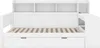 A white wooden bed frame with a slatted base and two drawers underneath. It has a built-in bookshelf at the headboard and a side unit with a shelf. Produktbild-Vorschau