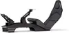 A black racing cockpit with pedals and a seat, shown from a side angle on a white background. Produktbild-Vorschau