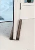 A draft stopper is placed at the bottom of a door to prevent drafts. Anteprima dell’immagine prodotto