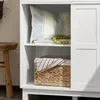 Interior shot of a white cabinet with shelves, showing decorative items and storage. Produktbild-Vorschau