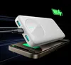 A white power bank is shown charging a smartphone wirelessly, with a charging icon in the upper right corner. Produktbild-Vorschau