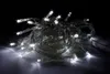 A tangled string of white LED lights on a dark background. Produktbild-Vorschau