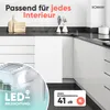 A modern kitchen setting with a white refrigerator and cabinets, showcasing the product's design and features. Produktbild-Vorschau