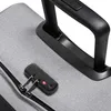 A close-up of a luggage lock and handle on a gray suitcase. Anteprima dell’immagine prodotto