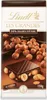A close-up shot of a Lindt chocolate bar with hazelnuts. Produktbild-Vorschau