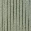 A close-up view of a textured fabric with vertical stripes. Produktbild-Vorschau