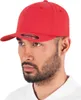 A man wearing a red baseball cap. Produktbild-Vorschau