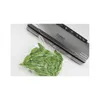 A vacuum-sealed bag of green beans next to a vacuum sealer. Produktbild-Vorschau