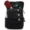 A black Vans backpack with various items inside and attached. Anteprima dell’immagine prodotto