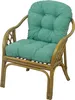 A close-up studio shot of a rattan chair with a green cushion. Podgląd zdjęcia produktu