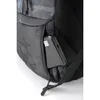 A close-up view of a black camouflage backpack with a black portable hard drive partially inserted into a zippered side pocket. Produktbild-Vorschau