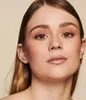 Close-up of a woman's face, focusing on her eye makeup and lips. Produktbild-Vorschau