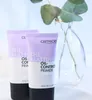 Two tubes of primer are shown in front of a vase with eucalyptus leaves. Voir les images du produit