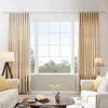 A living room scene with two sofas, a coffee table, and a large window with curtains. Produktbild-Vorschau