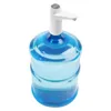 A water dispenser pump sits atop a large blue water jug. Podgląd zdjęcia produktu