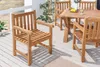 A wooden garden chair and table set on a wooden deck. Produktbild-Vorschau
