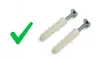 A green checkmark and two wall plugs with screws on a white background. Produktbild-Vorschau
