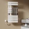 A white electric towel warmer mounted on a light brown wall, with a towel draped over it. Náhľad obrázku produktu